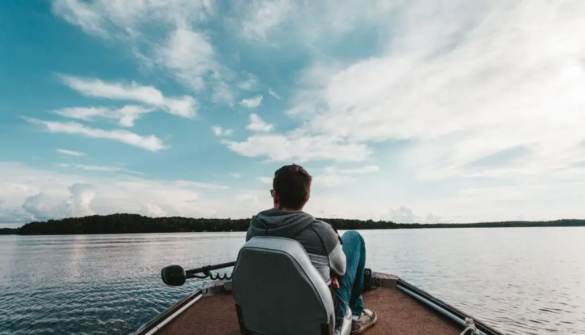 Man sitting on Bass Boat Bench