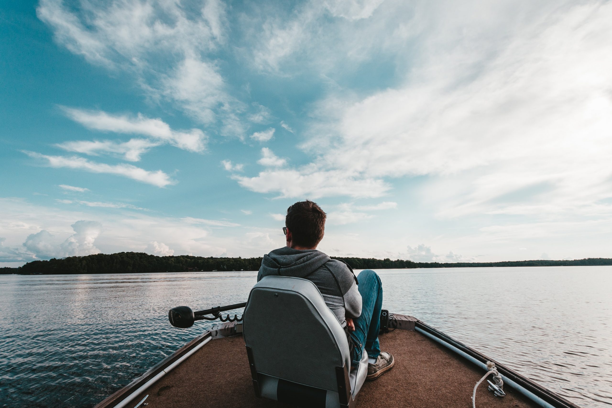 Man sitting on Bass Boat Bench